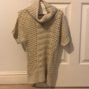 tan knitted turtleneck sweater with short sleeves